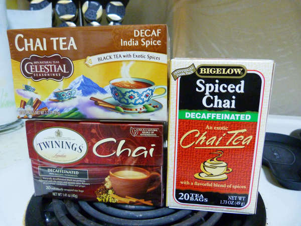 Boxes of Celestial Seasonings Decaf India Spice, Twinings Decaffeinated Chai, and Bigelow's Decaffeinated Spiced Chai tea bags